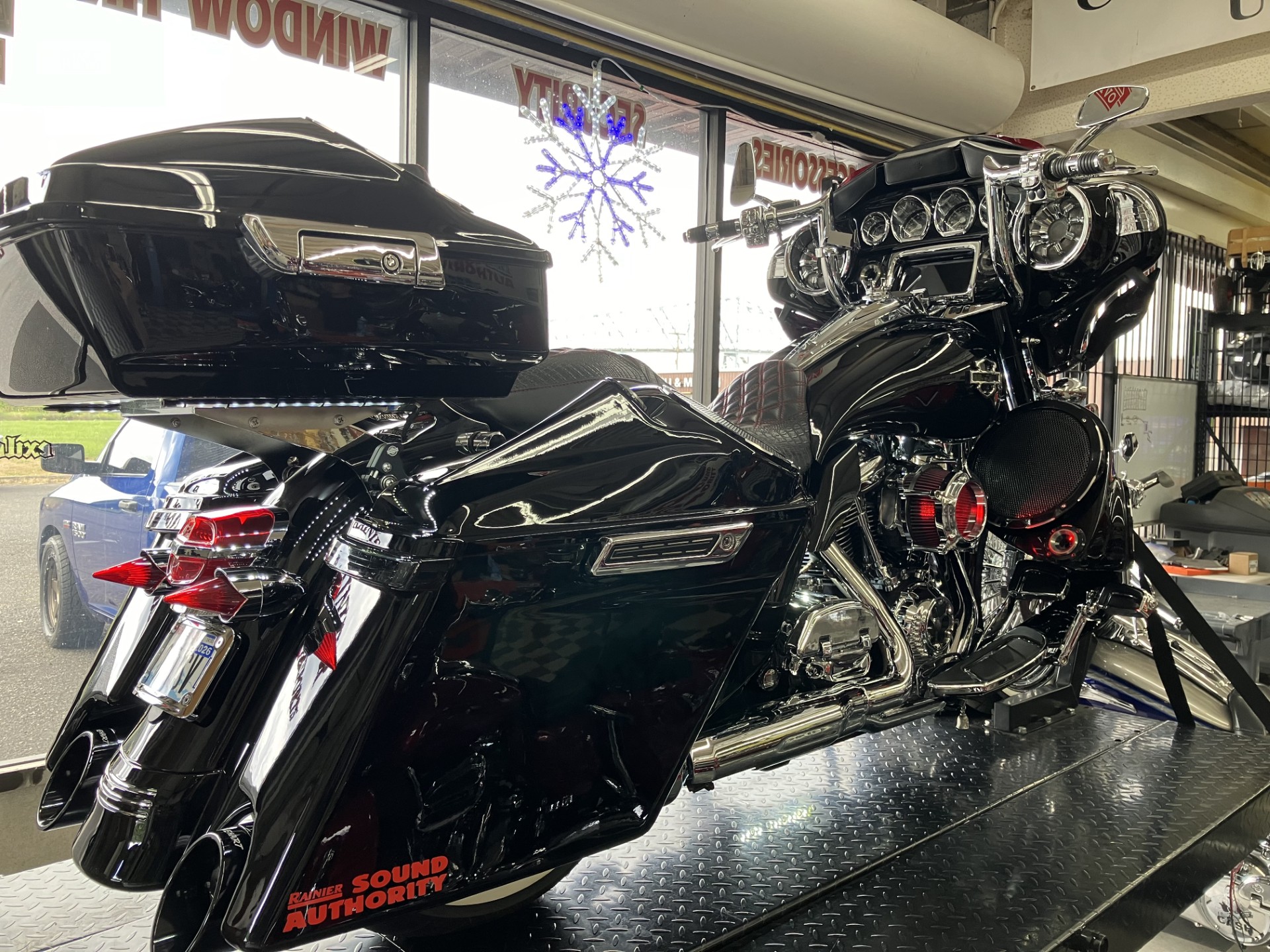 Black Harley Road Glide with Rainier Sound Authority branding
